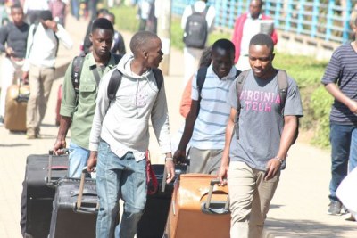 Students head home after the University of Nairobi was closed.