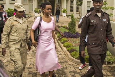 Diane Shima Rwigara escorted out of the Kigali High Court on November 7, 2017.