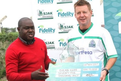 Gor Mahia head coach Dylan Kerr receiving the Fidelity Insurance Coach of the Month for September.
