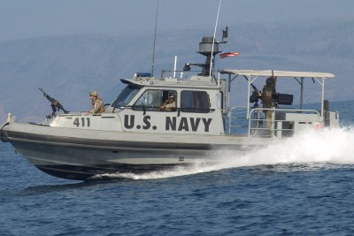 A U.S. Navy vessel operating from the biggest American military base in Africa patrols the port of Djibouti.