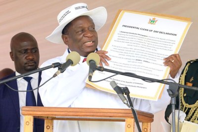 President Emmerson Mnangagwa holds the Presidential Clean-up Day Declaration which he launched in Highfield, Harare.