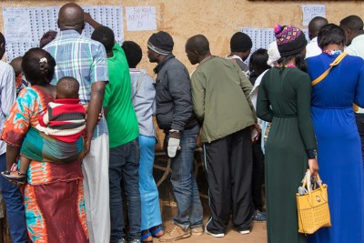 Voters look for their names in the lists during Presidential and Legislative elections in in the Democratic Republic of the Congo (30 December 2018).