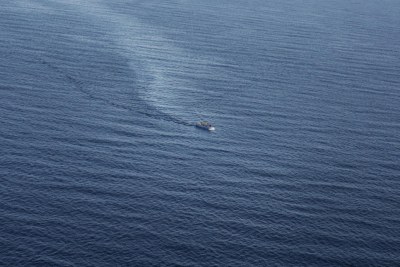 A boat packed with people is spotted in the Mediterranean Sea from an Italian rescue helicopter in June 2014.