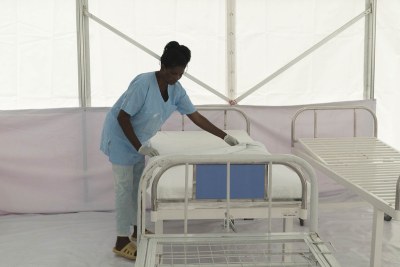 A nurse prepares a bed for a suspected case of Ebola in the isolation unit at Bwera hospital, Kasese district, located near the border with the DR Congo on September 3, 2018.