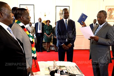President Emmerson Mnangagwa swears in Owen Ncube as the Minister of State Security at State House in Harare (file photo).