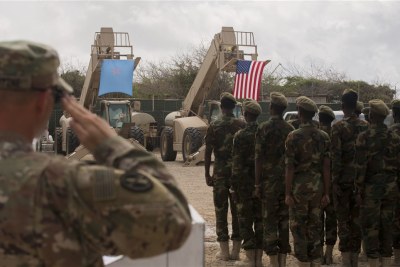 Somali national army soldiers stand in formation during a logistics course graduation ceremony following 14 weeks training with the U.S. 10th Mountain division.