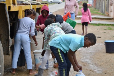 Residents fetch water from a truck on Jongilanga Street, KwaNobuhle. There is more demand than water to go around.