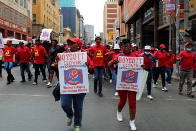 Clover workers, who have been on strike since November 2021, march through Johannesburg.