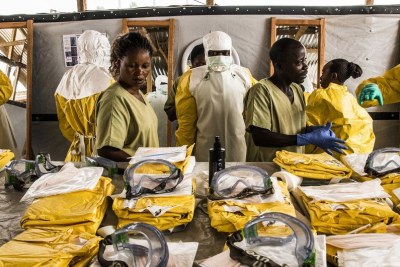 Health workers put on personal protective equipment (PPE) before entering an Ebola quarantine zone in the Democratic Republic of the Congo. (file)
